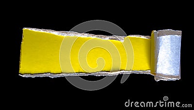 Black torn paper with space for text with a yellow background. A piece of torn black paper, copy space Stock Photo