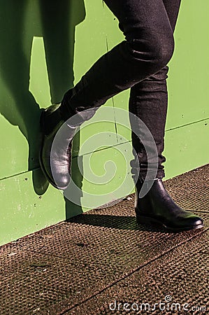 Black trousers and ladies vintage boots Stock Photo