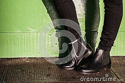 Black trousers and ladies vintage boots Stock Photo