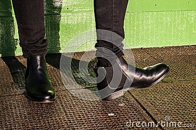 Black trousers and ladies vintage boots Stock Photo