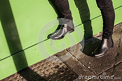 Black trousers and ladies vintage boots Stock Photo