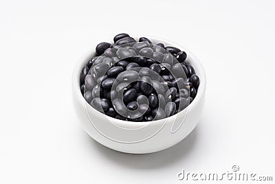 Black turtle beans bowl on white background Stock Photo