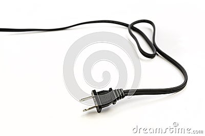 Black two pronged power cord with a curl trailing off into the distance Stock Photo