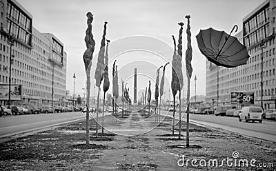 Black umbrella flying along the street Stock Photo