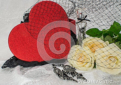 Black underwear knickers in gliter red box heart shaped perfume white roses juwelery on white background Stock Photo