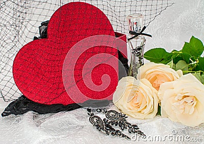 Black underwear knickers in gliter red box heart shaped perfume white roses juwelery on white background Stock Photo