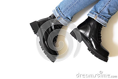 Black unisex boots isolated on white background for winter and autumn weather with round toe, block heel and embossed Stock Photo