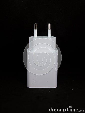 White USB charger head/adapter in black isolated background Stock Photo