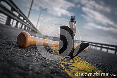 the black vaporizer on a grey pavement Stock Photo