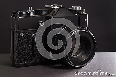 Black vintage film camera on dark background withot brand Stock Photo