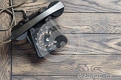 Black vintage telephone on table above with copy space Stock Photo