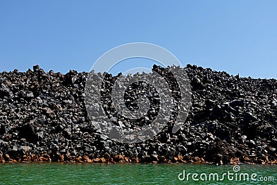 Black Volcanic Rock Shore With Seabirds Stock Photo