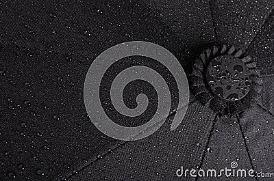 Black waterproof umbrella texture with water droplets Stock Photo