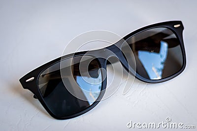 Black wayfarer sunglasses on white background Stock Photo