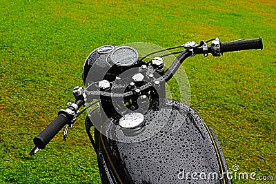 Black wet vintage motorbike Stock Photo