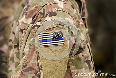 Black and white American flag with thin blue line on military uniform. Thin blue line flag. Thin blue line flag law enforcement Stock Photo