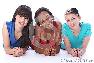 Black white and asian girl friends lying on floor Stock Photo