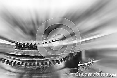 Black and white background. Metal Cogwheels in clock mechanism. Macro Stock Photo