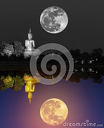 Black and white big buddha statue with super moon and colorful big golden buddha statue reflection Stock Photo