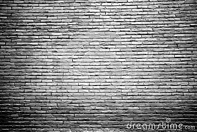 Black and White Brick Wall with Highlighted Center Stock Photo