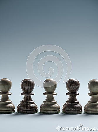 Chess pawns standing together in line Stock Photo