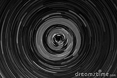 Black and white circular blur in the form of a whirl background texture, radial blur, abstract twist, funnel Stock Photo