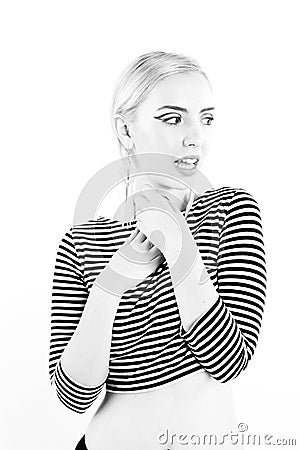 Black and white expressive portrait of a young stylish woman wearing stripes in the studio Stock Photo