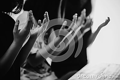 Black and white of group people praying worship believe Stock Photo