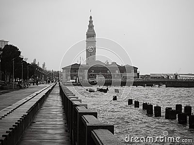 Black and white image of the ferry building in San Francisco on a rainy day Editorial Stock Photo