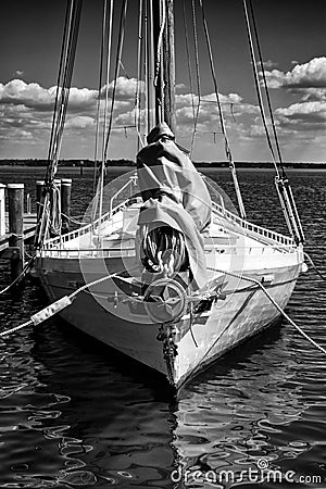 Black and white image of a historic skipjack sailing vessel Stock Photo