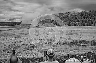Black and white infrared view of Old Faithful in Yellowstone National Park, WY Editorial Stock Photo