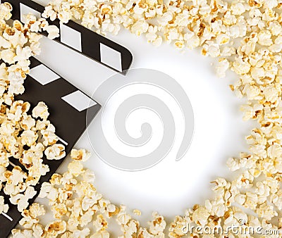 Black with white letters party poppers, lot of popcorn on white. Stock Photo