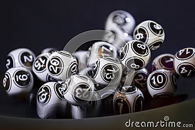 Black and white lottery balls in a machine 13 Stock Photo