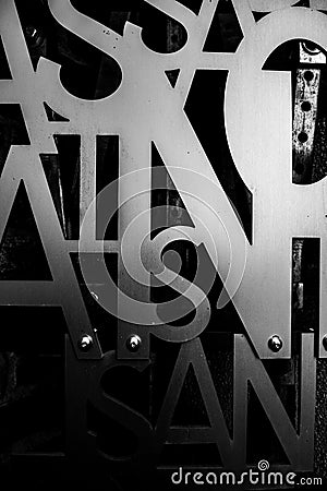 Black and white Macro Metal texture. Typography letter art design resource Editorial Stock Photo