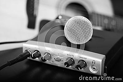 Black and white microphone on home recording studio with guitar Stock Photo