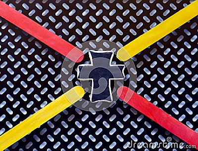 This black white modern view shows a cross in the center with crisscross bright pointers in yellow & red. Stock Photo