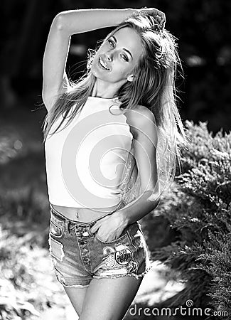 Black-white outdoor portrait of beautiful young sexual blonde woman against nature background Stock Photo