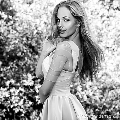 Black-white outdoor portrait of beautiful young sexual blonde woman against nature background Stock Photo