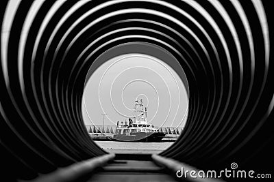 Sea ship in a spiral frame, that stands at the pier, Stock Photo