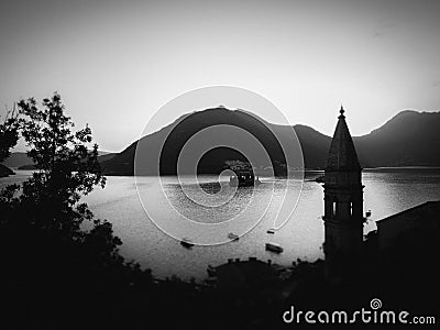 Black-and-white photo of the aerial view of Kotor Bay with the mosque minaret in the foreground Stock Photo