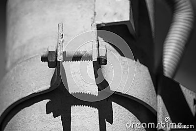 Black and white photo bolted metal pipe clamp Stock Photo