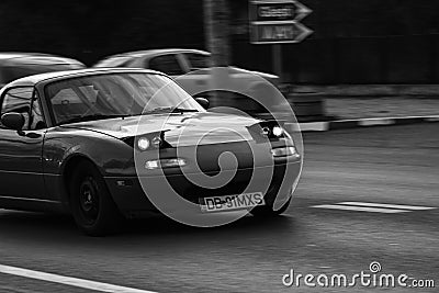 Black and white photo, classic, vintage car. Classic car with hidden headlight on the roads of Bucharest, Romania, 2020 Editorial Stock Photo