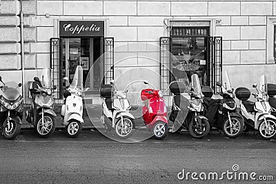 Bright red Vespa scooter against black and white Editorial Stock Photo