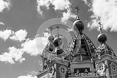 Black and white photo of a sky background with clouds fragment of church domes Stock Photo