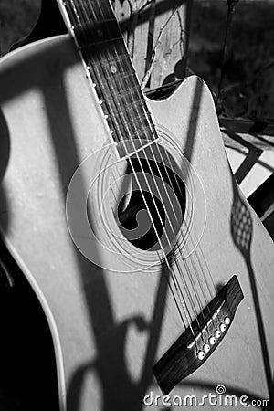 Black and white photograph of a vintage acoustic guitar Stock Photo