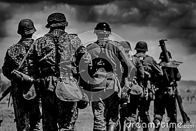 The group of soldiers is marching to the battle Stock Photo