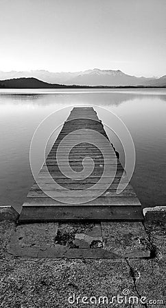 Black and white pier on the lake Stock Photo