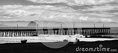 Black and White Pier Seascape with Surf Clouds and Morro Rock Stock Photo