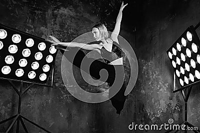 Black and white portrait of beautiful attractive blonde young woman dancer on the stage Stock Photo