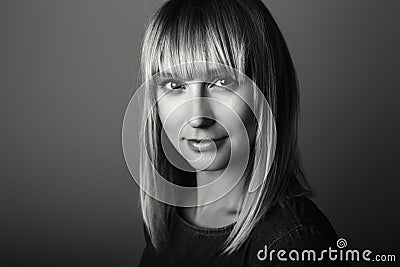 Black-and-white portrait of beautiful young middle age blonde Caucasian woman looking in camera Stock Photo